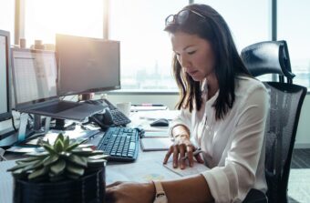 Woman works at a desk in a modern office building