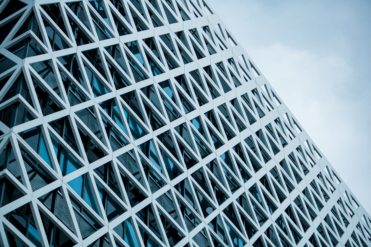 Modern Business Building with Glass Facade with Metal Triangles in Luminescent Elegance